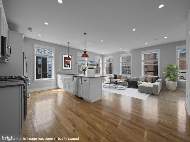 106-12 W Jefferson St Unit 2, Philadelphia, PA 19122 - kitchen featuring recessed lighting, appliances with stainless steel finishes, light wood-style flooring, and a sink