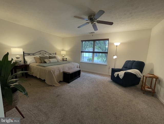 carpeted bedroom with baseboards and ceiling fan