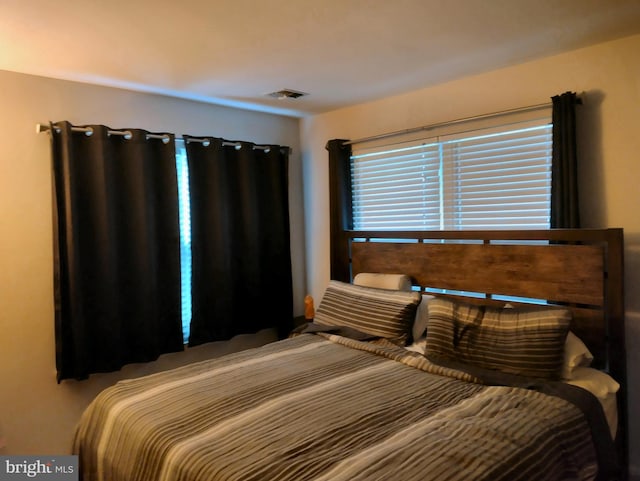 bedroom with visible vents