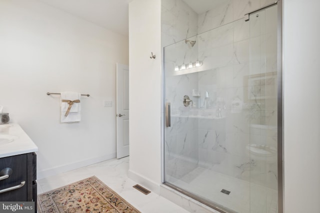 bathroom featuring a marble finish shower, baseboards, visible vents, and marble finish floor