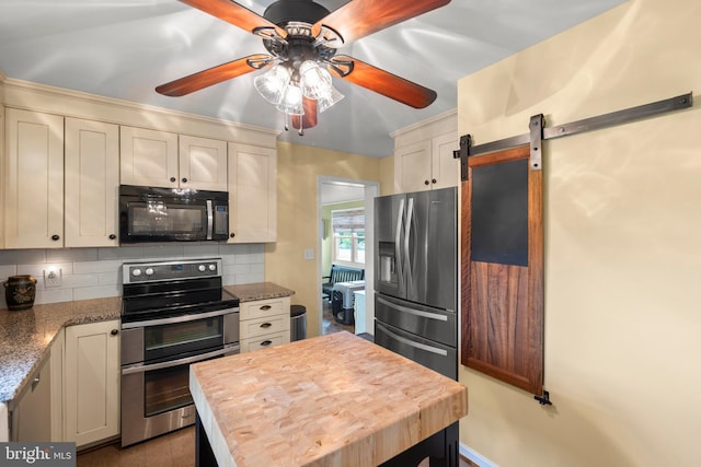 111 Heron Ln, Augusta, WV 26704 - kitchen with appliances with stainless steel finishes, decorative backsplash, ceiling fan, and a barn door