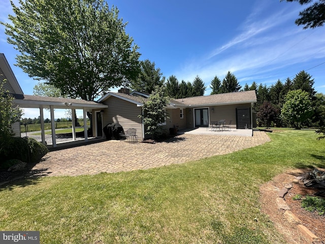 111 Heron Ln, Augusta, WV 26704 - back of property featuring french doors, a lawn, and a patio
