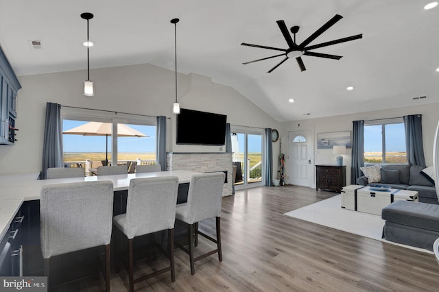 dining room with a ceiling fan, recessed lighting, wood finished floors, and visible vents