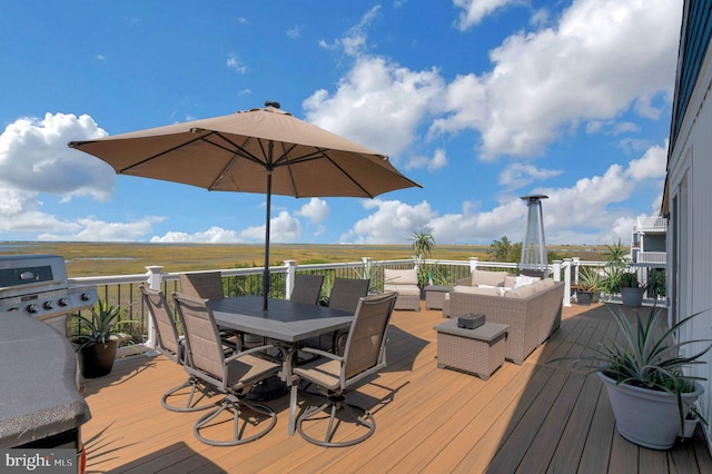 wooden terrace with area for grilling, outdoor lounge area, and outdoor dining area