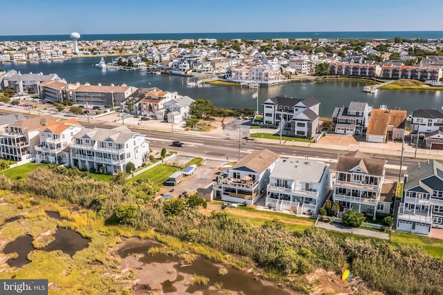 aerial view featuring a water view and a residential view
