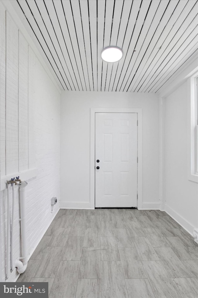 spare room with baseboards