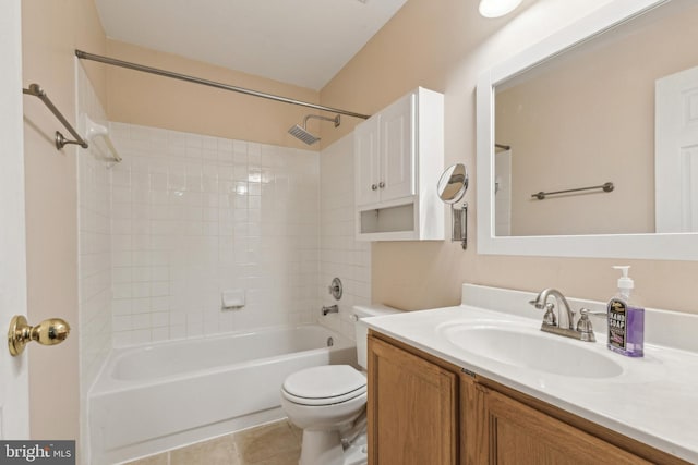 full bath featuring toilet, tile patterned flooring, bathtub / shower combination, and vanity
