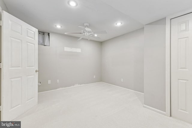 finished basement featuring carpet floors, recessed lighting, baseboards, and ceiling fan