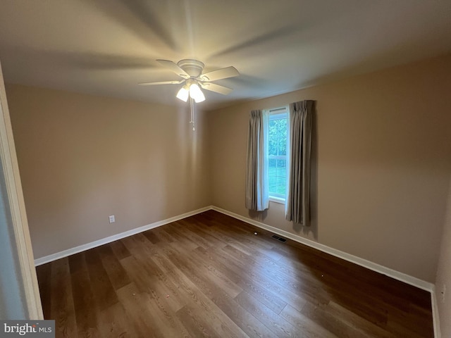 16722 Custer Ct, Williamsport, MD 21795 - spare room featuring ceiling fan, baseboards, dark wood-type flooring, and visible vents