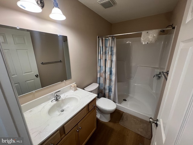 16722 Custer Ct, Williamsport, MD 21795 - bathroom with toilet, a shower with curtain, wood finished floors, vanity, and visible vents