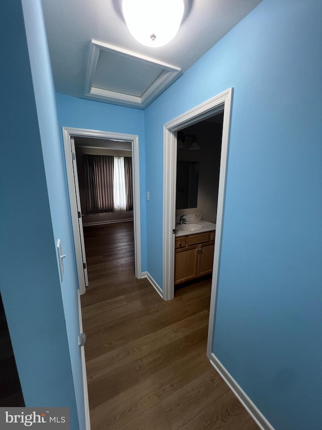 16722 Custer Ct, Williamsport, MD 21795 - corridor with attic access, dark wood-style flooring, baseboards, and a sink