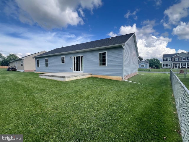 16722 Custer Ct, Williamsport, MD 21795 - rear view of house with a patio, fence, and a lawn