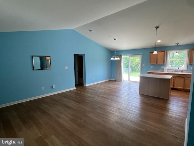 16722 Custer Ct, Williamsport, MD 21795 - unfurnished living room with lofted ceiling, baseboards, a sink, and dark wood-type flooring