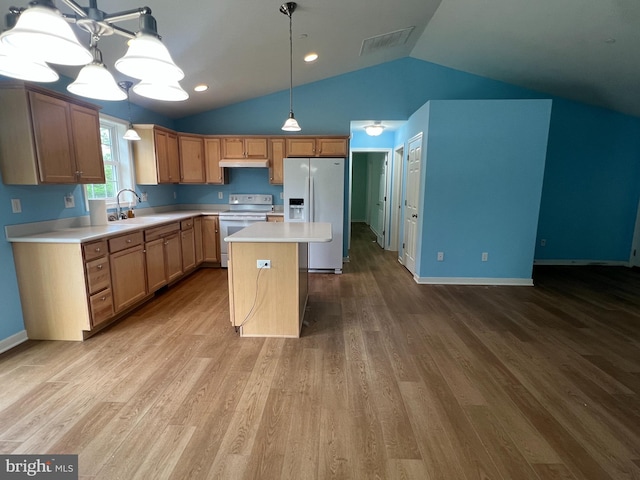 16722 Custer Ct, Williamsport, MD 21795 - kitchen with a sink, lofted ceiling, light countertops, refrigerator with ice dispenser, and electric stove