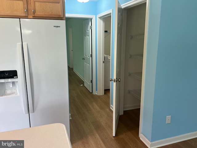 16722 Custer Ct, Williamsport, MD 21795 - kitchen featuring white fridge with ice dispenser, baseboards, dark wood finished floors, and washer / dryer