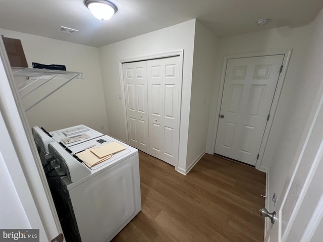 16722 Custer Ct, Williamsport, MD 21795 - laundry room featuring washer and clothes dryer, laundry area, visible vents, dark wood finished floors, and baseboards
