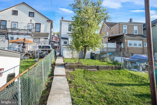 view of property's community featuring fence