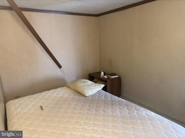 1646 W Norwegian St, Pottsville, PA 17901 - bedroom featuring ornamental molding and a decorative wall