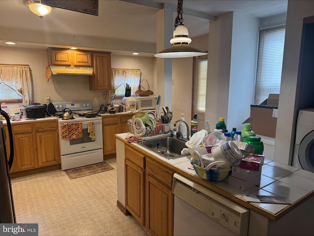 1646 W Norwegian St, Pottsville, PA 17901 - kitchen with pendant lighting, white appliances, tile countertops, under cabinet range hood, and a sink