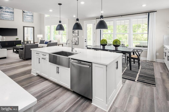 2682 Broadhorn Dr, Odenton, MD 21113 - kitchen with a sink, light wood-style floors, light countertops, stainless steel dishwasher, and a center island with sink