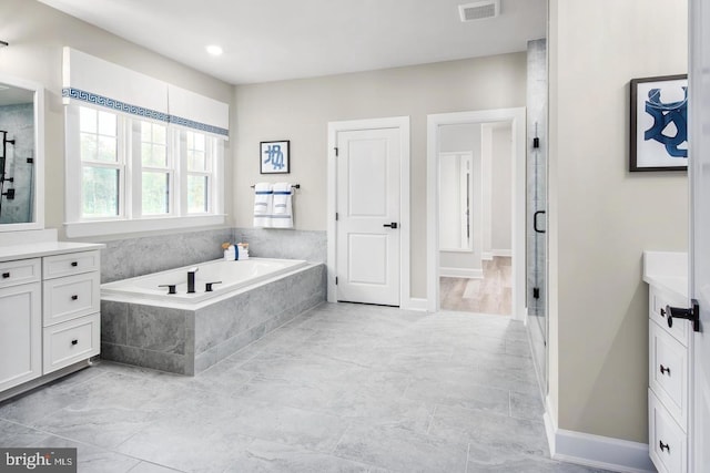2682 Broadhorn Dr, Odenton, MD 21113 - bathroom featuring vanity, baseboards, visible vents, a bath, and a stall shower