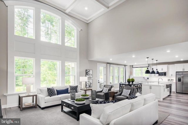 2682 Broadhorn Dr, Odenton, MD 21113 - living area featuring crown molding, a high ceiling, recessed lighting, light wood-type flooring, and beamed ceiling