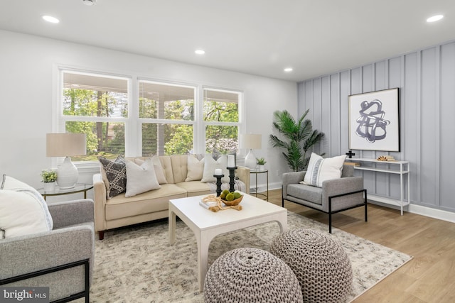 living room with recessed lighting and wood finished floors