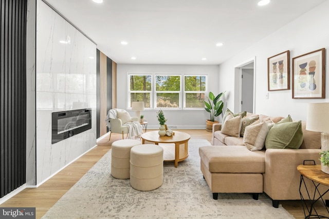 living room featuring recessed lighting and light wood-type flooring