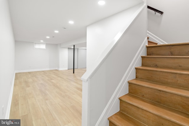 stairs featuring recessed lighting, baseboards, and wood finished floors