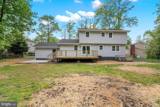 back of house featuring fence, central air condition unit, a yard, and a deck