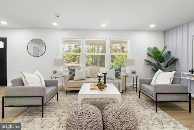 living area with recessed lighting, a healthy amount of sunlight, and light wood finished floors