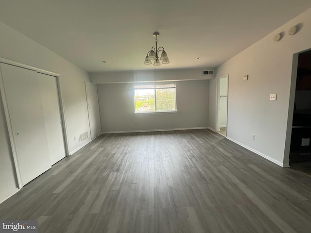 7521 Riverdale Rd Unit 1979, New Carrollton, MD 20784 - interior space with an inviting chandelier, baseboards, dark wood-style floors, and visible vents