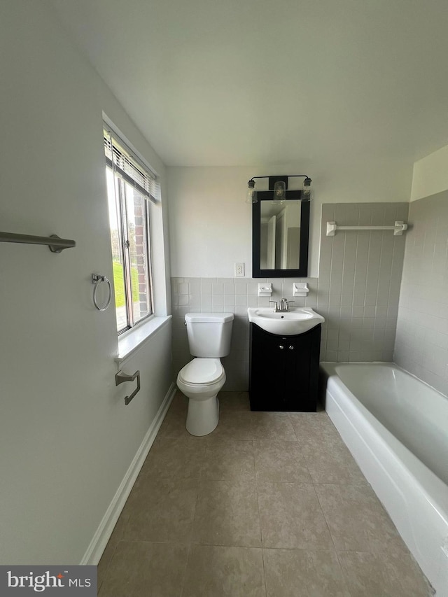 7521 Riverdale Rd Unit 1979, New Carrollton, MD 20784 - full bathroom with toilet, tile patterned floors, a bath, and vanity