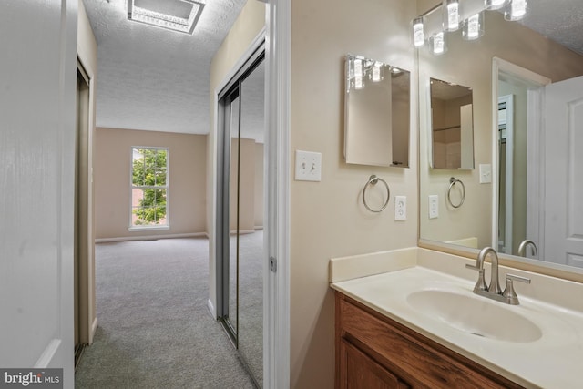 3707 Elmcrest Ln, Bowie, MD 20716 - bathroom with vanity and a textured ceiling