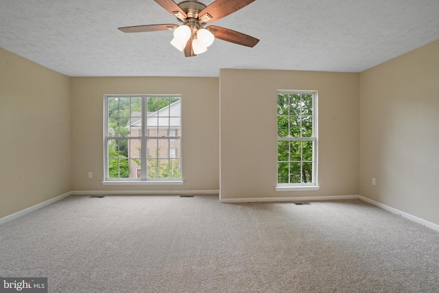 3707 Elmcrest Ln, Bowie, MD 20716 - empty room with healthy amount of natural light, a textured ceiling, carpet, and baseboards