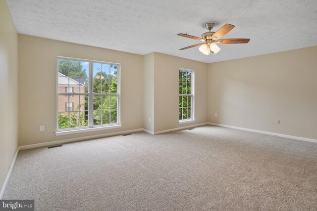 3707 Elmcrest Ln, Bowie, MD 20716 - carpeted empty room with healthy amount of natural light, baseboards, a textured ceiling, and ceiling fan