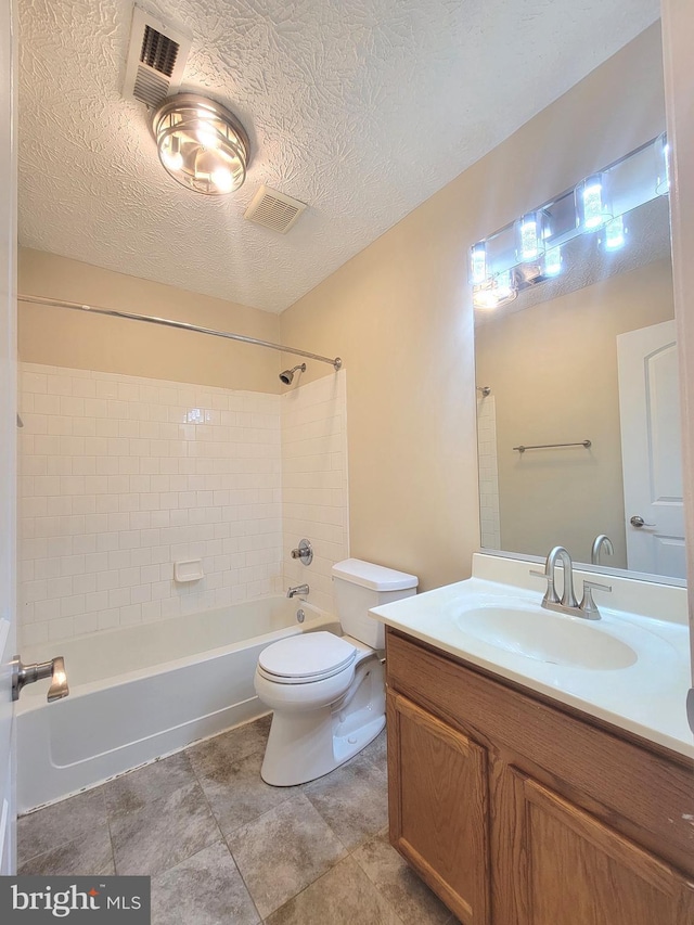 3707 Elmcrest Ln, Bowie, MD 20716 - bathroom with tub / shower combination, toilet, vanity, and a textured ceiling