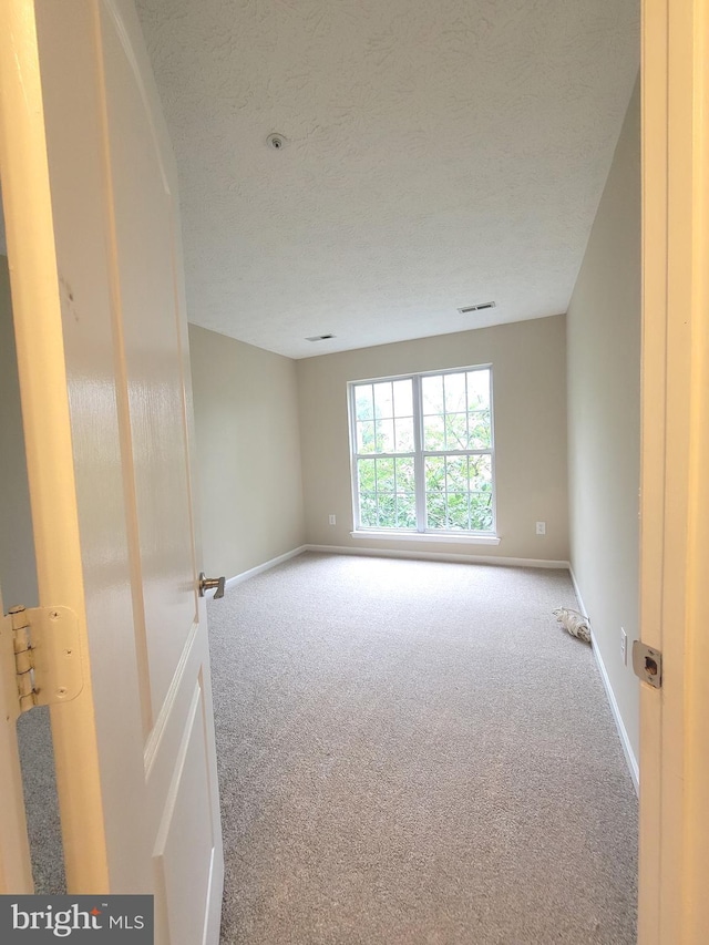 3707 Elmcrest Ln, Bowie, MD 20716 - carpeted empty room featuring baseboards and a textured ceiling
