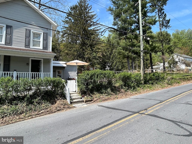 view of side of property featuring a porch