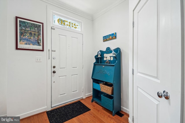2350 Cobble Hill Ter, Wheaton, MD 20902 - foyer featuring light wood finished floors, crown molding, and baseboards