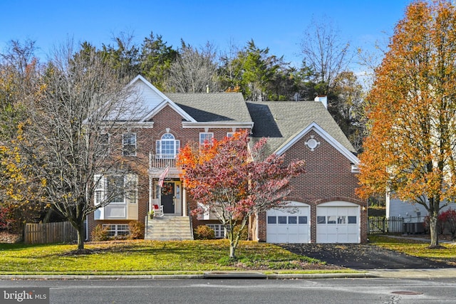902 Santmyer Dr SE, Leesburg, VA 20175 - colonial home with brick siding, asphalt driveway, and a garage