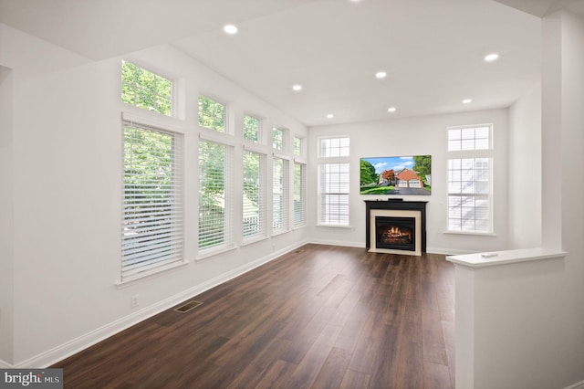 902 Santmyer Dr SE, Leesburg, VA 20175 - unfurnished living room with dark wood-type flooring, baseboards, a lit fireplace, and recessed lighting