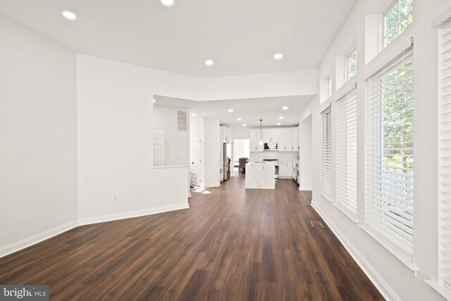 902 Santmyer Dr SE, Leesburg, VA 20175 - unfurnished living room with dark wood-style floors, recessed lighting, and baseboards