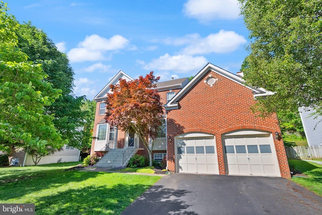 902 Santmyer Dr SE, Leesburg, VA 20175 - traditional-style home with brick siding, asphalt driveway, and a front lawn