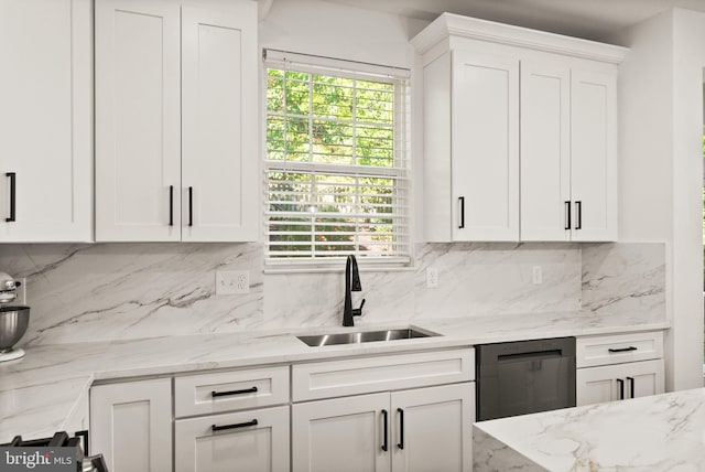 902 Santmyer Dr SE, Leesburg, VA 20175 - kitchen featuring a sink, dishwashing machine, white cabinets, and tasteful backsplash