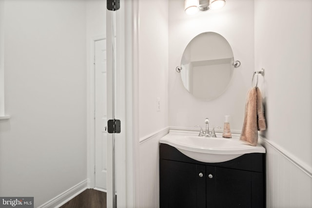 902 Santmyer Dr SE, Leesburg, VA 20175 - bathroom with vanity, wainscoting, and wood finished floors