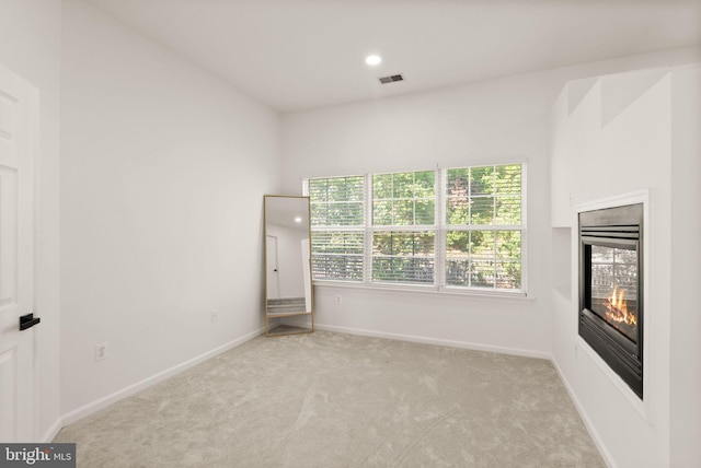 902 Santmyer Dr SE, Leesburg, VA 20175 - unfurnished room featuring a glass covered fireplace, carpet flooring, baseboards, and recessed lighting
