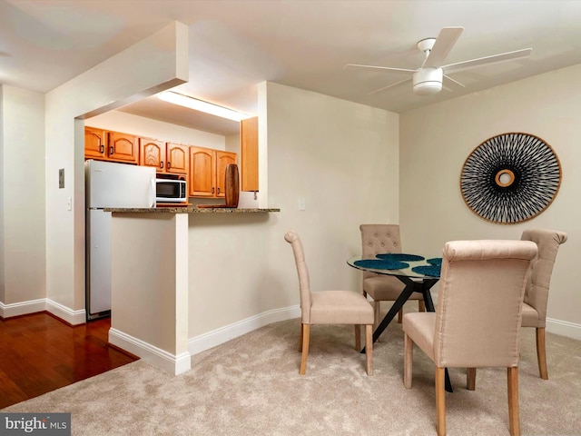 316 Burnside St Unit 101, Annapolis, MD 21403 - dining area featuring ceiling fan and light colored carpet