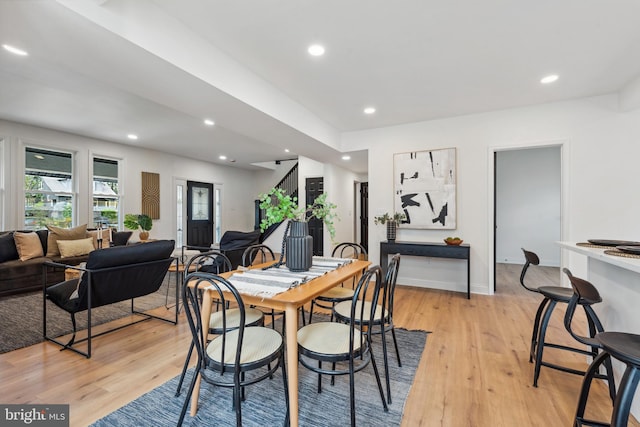 dining space featuring recessed lighting, light wood-style flooring, and baseboards