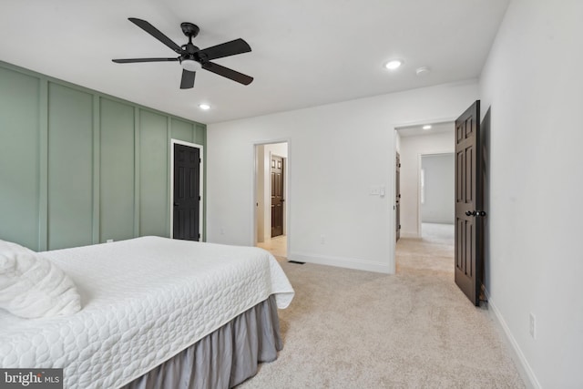 bedroom with baseboards, ceiling fan, light carpet, and recessed lighting